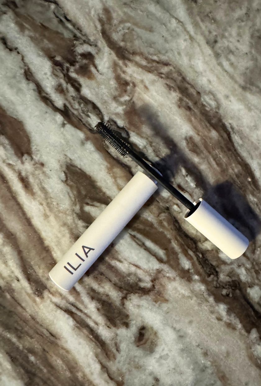 A photo of the Ilia Limitless Mascara on a marble table