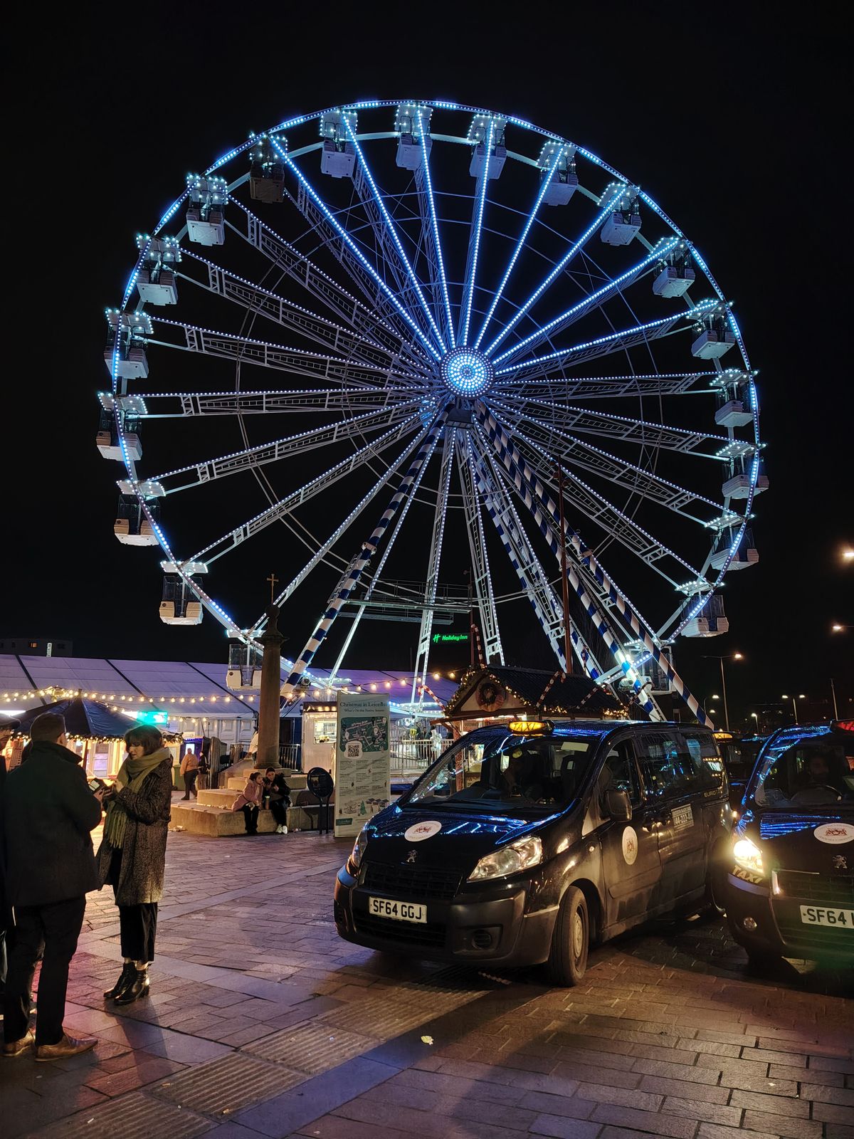 Ferris wheel lit up at night