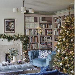 Classy sitting room with fireplace and Christmas tree