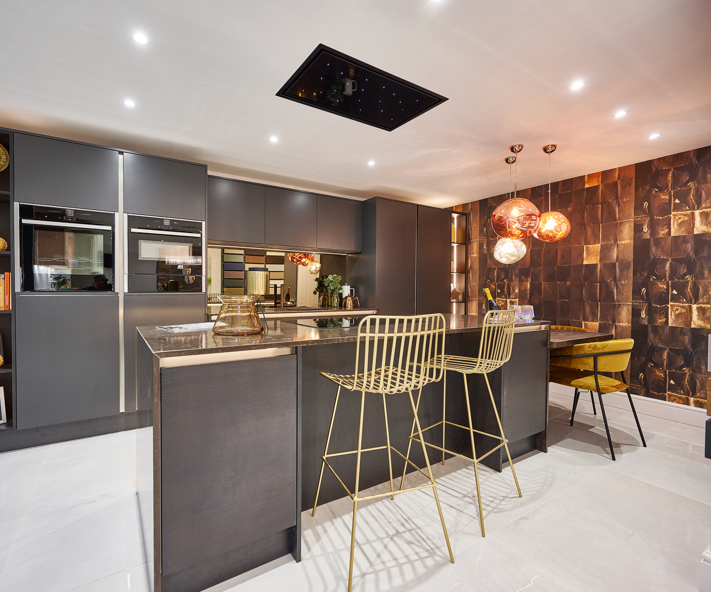 gold metallic breakfast bar stools next to island