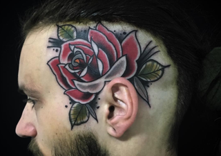 red rose tattoo on head