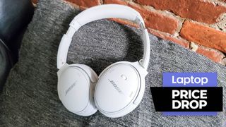Bose QuietComfort 45 headphones in white with brick wall background
