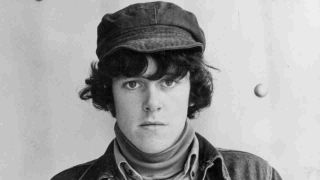 Donovan posing for a photograph in the 60s
