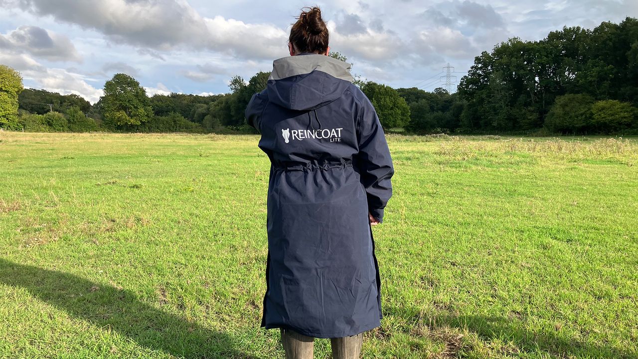 Lady wears Reincoat Lite, viewed from the back