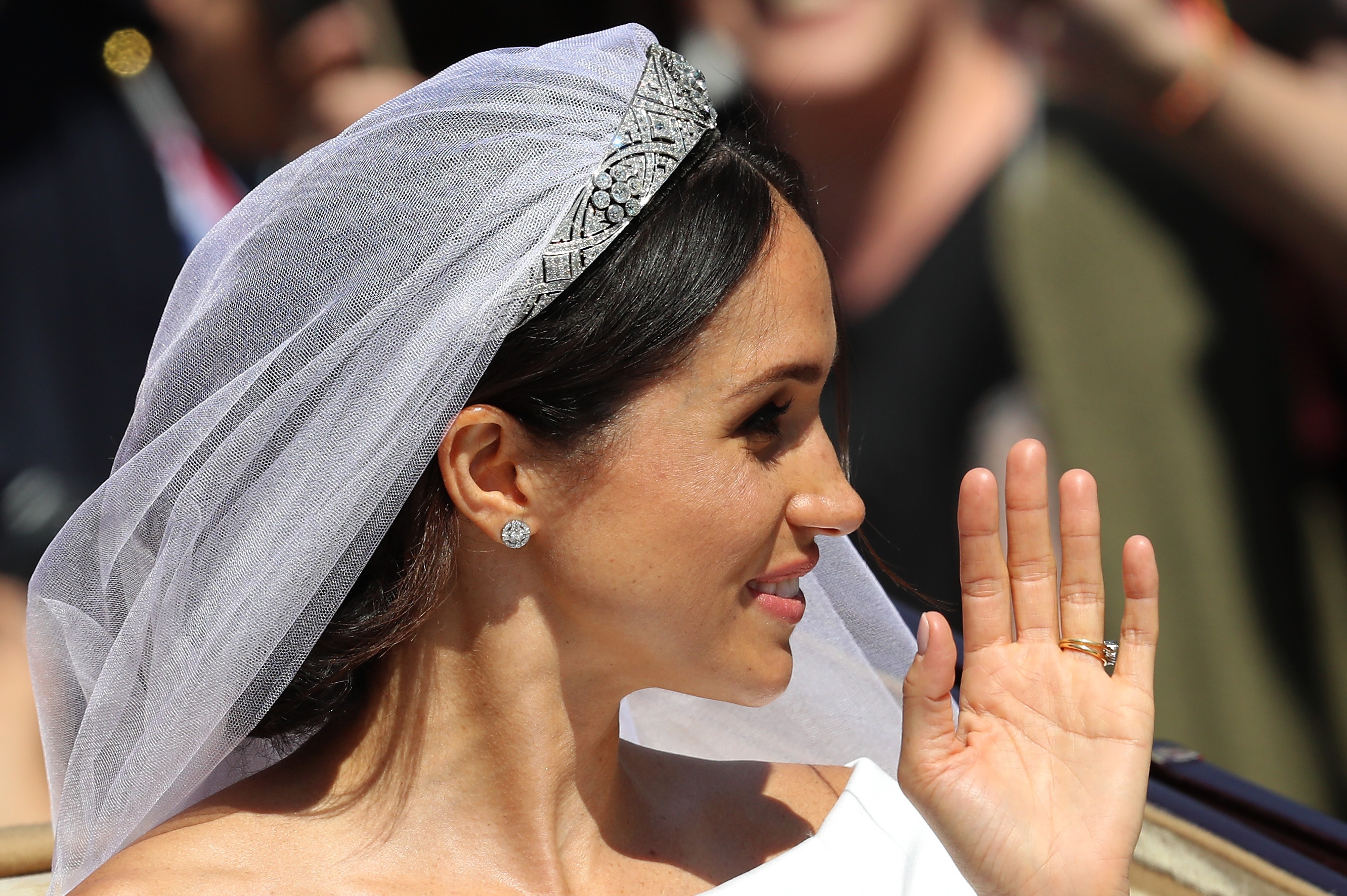 Meghan Markle waving to fans on her wedding day