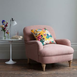 arm rest couch in living room with floral cushion