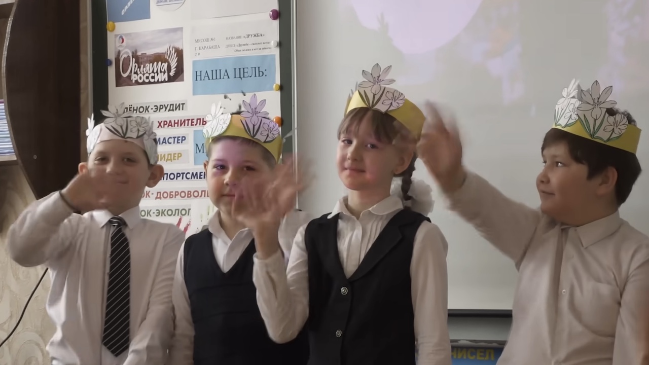 Kids waving in the trailer for Mr Nobody Against Putin.