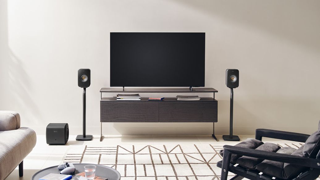 KEF LSX II speakers either side of a large TV