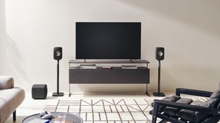 KEF LSX II speakers either side of a large TV