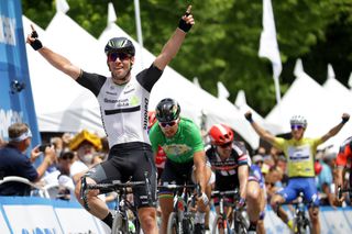 Mark Cavendish raises his arms to celebrate the stage while Julian Alaphilippe raises his arms to celebrate the overall win