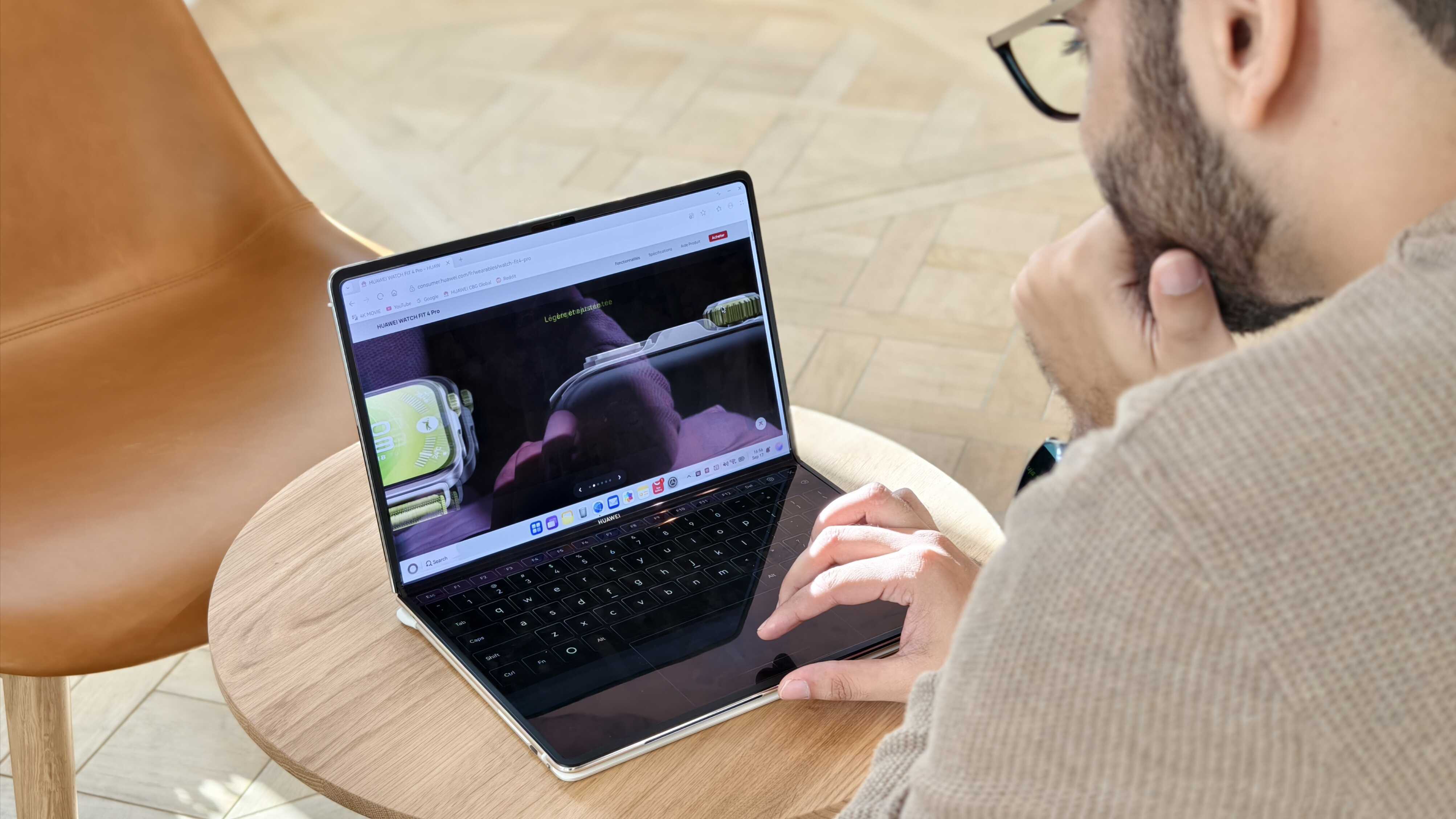 Prakhar Khanna using the Huawei MateBook Fold half-folded.