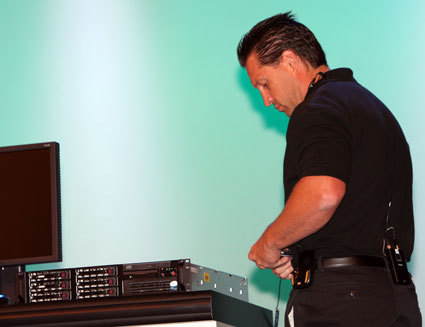Safety first! Intel employee connects anti-static strap as he starts changing out the processors.