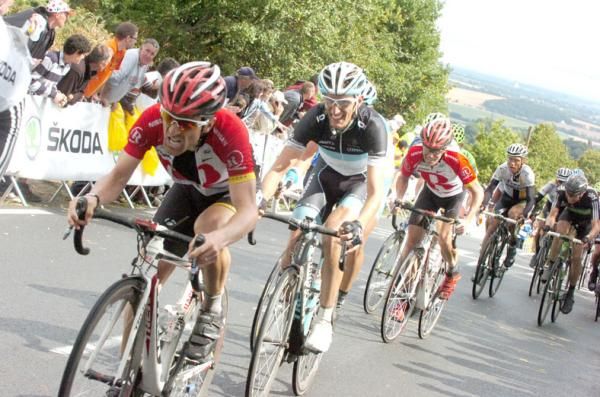 Andy Schleck (Leopard Trek) grits his teeth as he attempts to follow Levi Leipheimer (RadioShack).