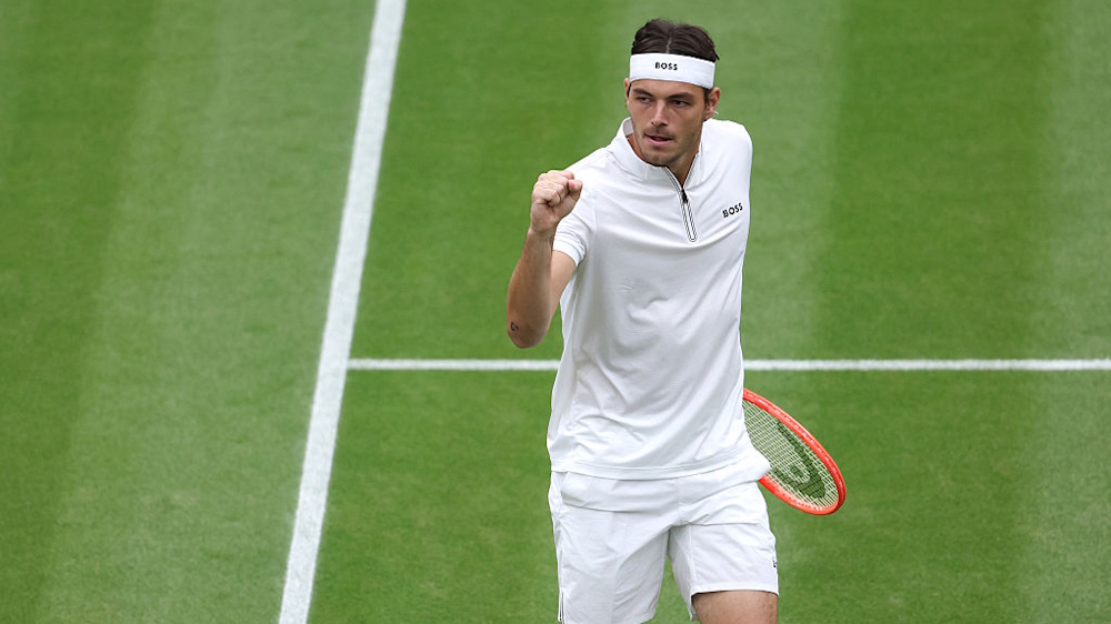 Taylor Fritz celebrating a point at Wimbledon 2025.