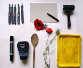 lino printmaking: tools including carving tools and ink