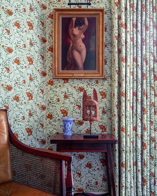 study with patterned wallpaper and curtains