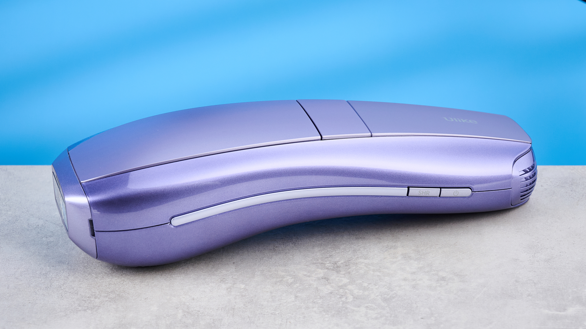 ULike Air 10 IPL machine photographed in front of a blue background.