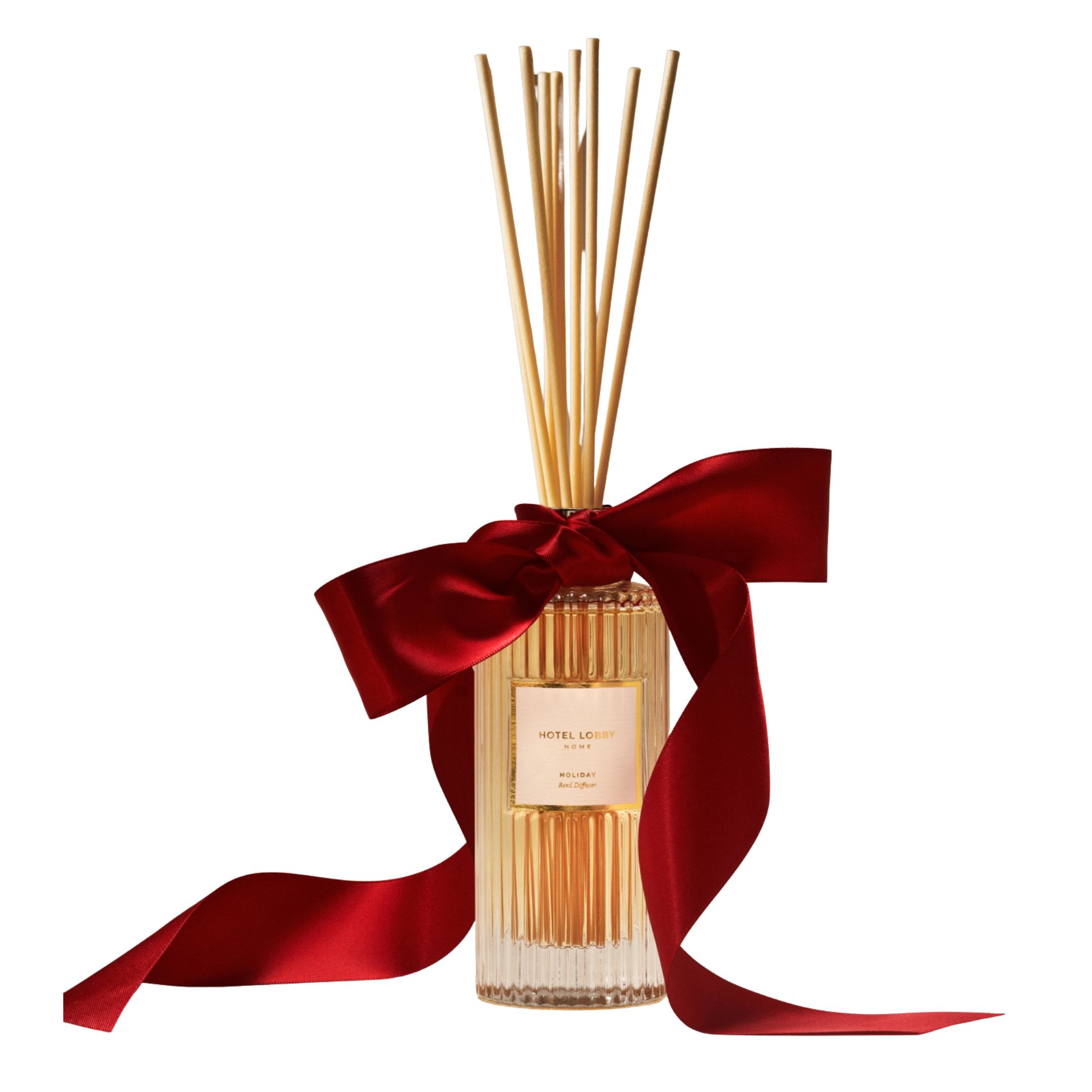 Hotel Lobby fluted glass reed diffuser with large red ribbon tied in a bow