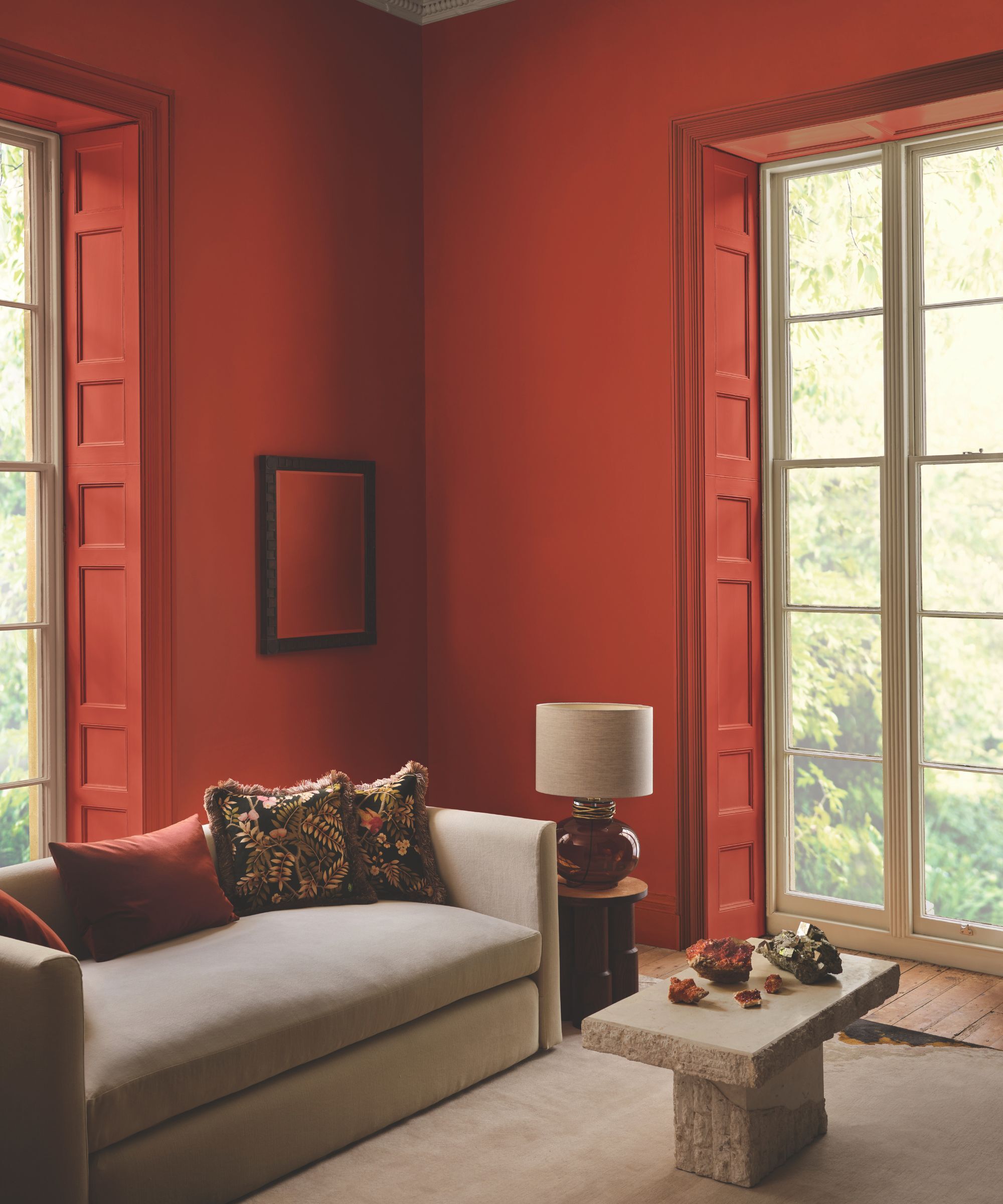 A modern sitting room with walls painted in bright red