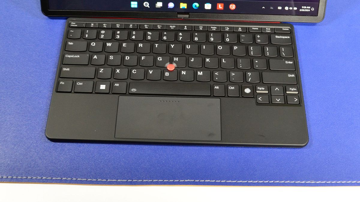 A Lenovo ThinkPad X1 Fold 16 Gen 1 on a white desk