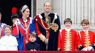 Princess Charlotte, Catherine, Princess of Wales, Prince Louis, Prince William, Prince of Wales, Page of Honour Ralph Tollemache and Prince George of Wales watch an RAF flypast