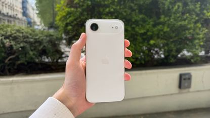 The iPhone Air being held in the hand