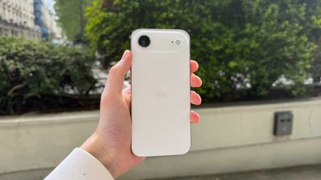 The iPhone Air being held in the hand