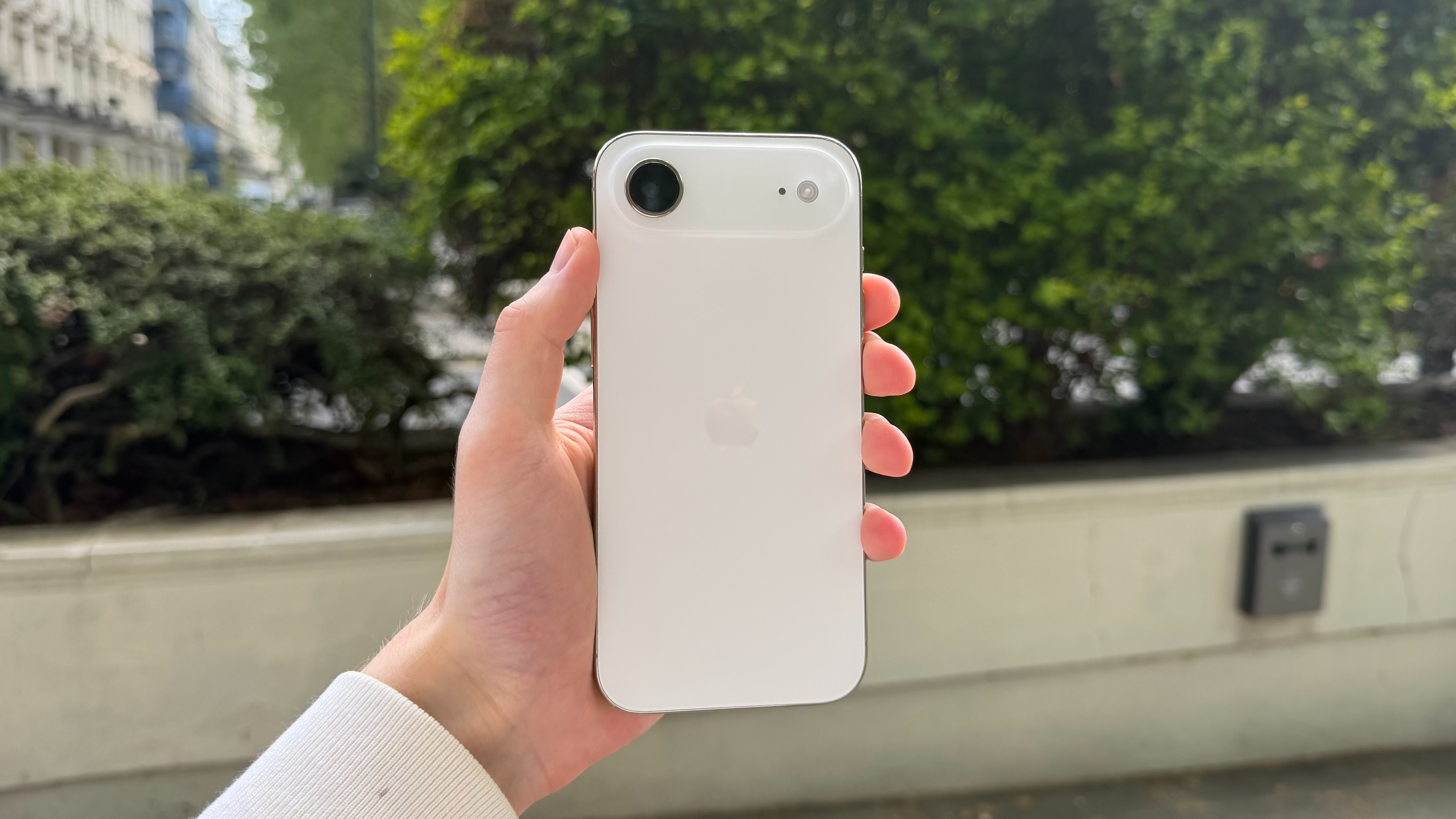 The iPhone Air being held in the hand