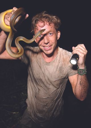 Jack Randall poses with a Water Python