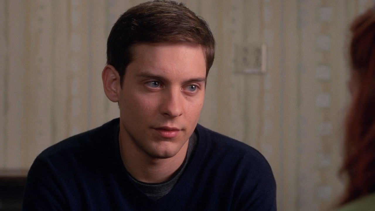 Tobey Maguire as Peter Parker looking at MJ in Spider-Man