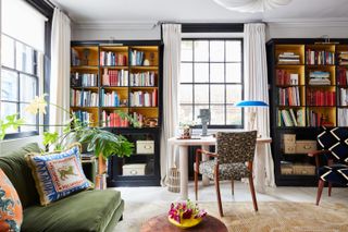 eclectic home office with green sofa by Studio Ashby