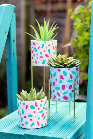 Trio of plant pots given a DIY terrazzo paint effect
