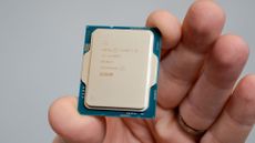 A hand holding an Intel Core i5-14600K