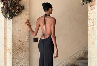 Dana Nozime wears a backless black dress.