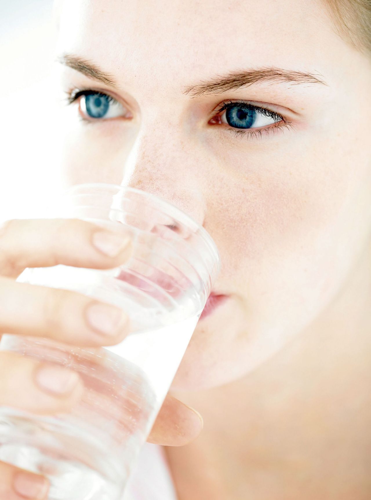 Woman drinking water photo