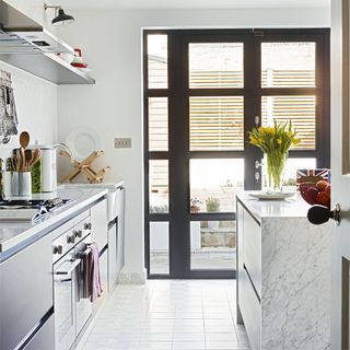 modern white kitchen with grey french doors