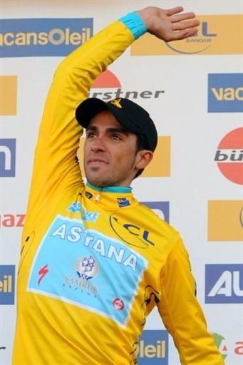 Alberto Contador (Astana) tosses the bouquet after the yellow jersey ceremony in Paris-Nice