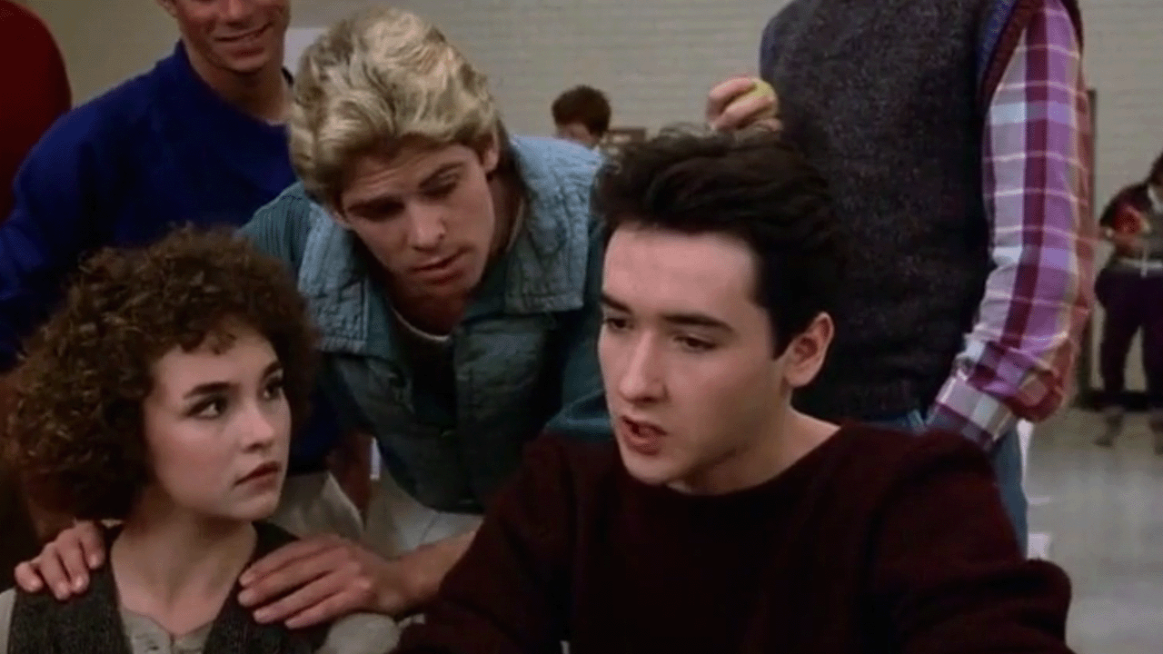 John Cusack looking upset with a couple of other people in Better Off Dead.