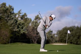 Rafa Cabrera Bello hitting a wedge shot into the green