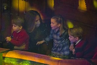 Catherine, Duchess of Cambridge, Prince Louis, Princess Charlotte and Prince George attend a special pantomime performance at London's Palladium Theatre, hosted by The National Lottery, to thank key workers and their families for their efforts throughout the pandemic