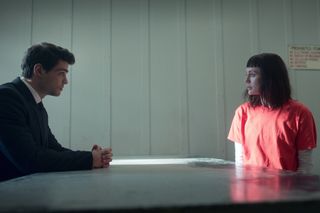 (L to R) Noah Centineo as Owen Hendricks, Laura Haddock as Max Meladze sitting across each other at a table