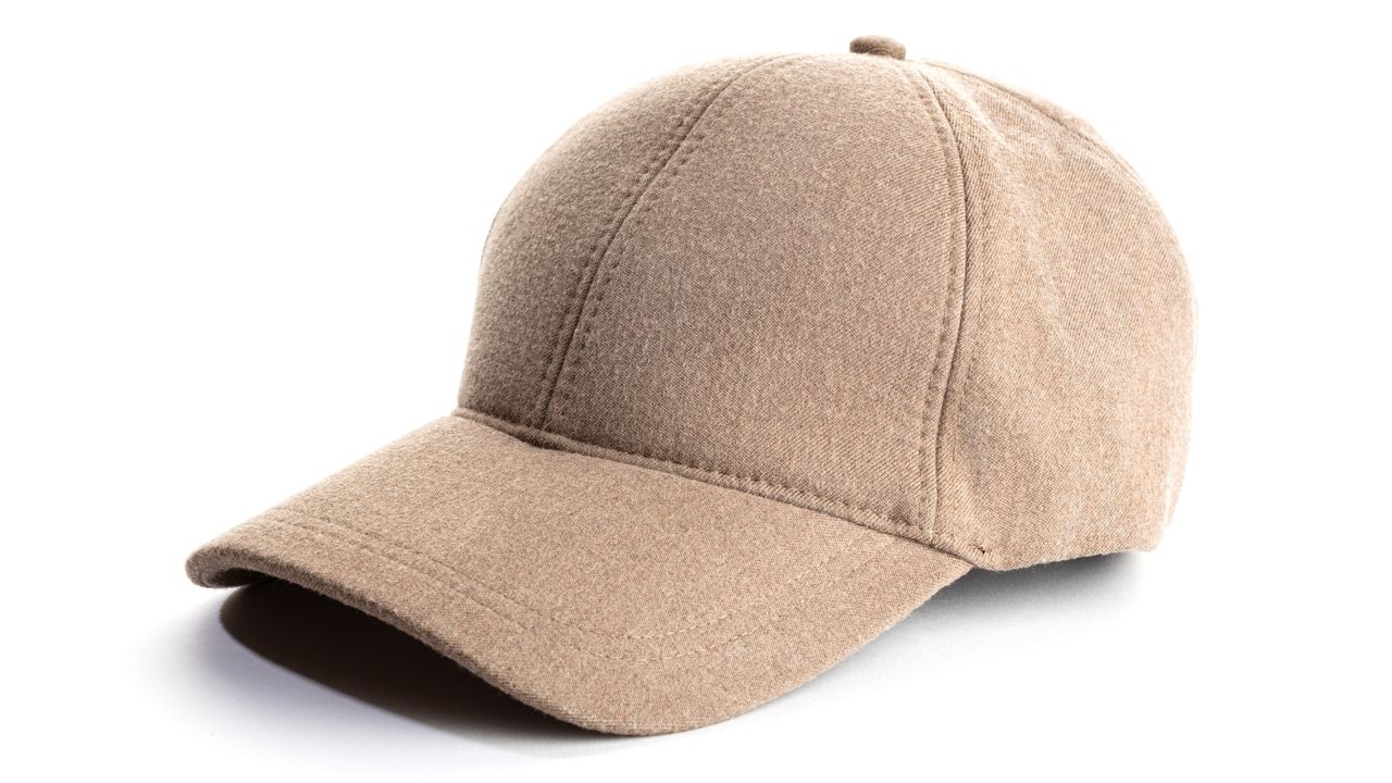 Neutral beige baseball cap on white background