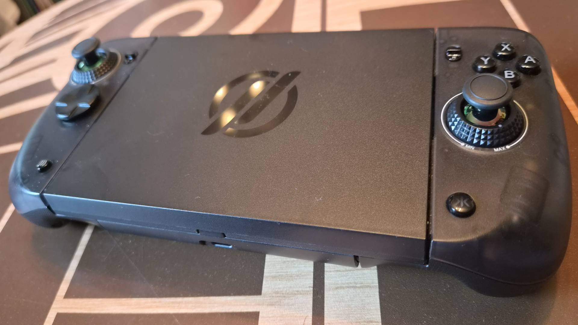Photo of the CRKD Nitro Deck 2 sitting on a Star Wars-themed wooden table.