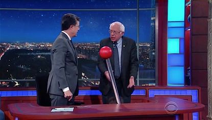 Bernie Sanders helps Stephen Colbert play "Wheel of News"