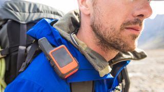 A gps device for hiking on a backpack strap