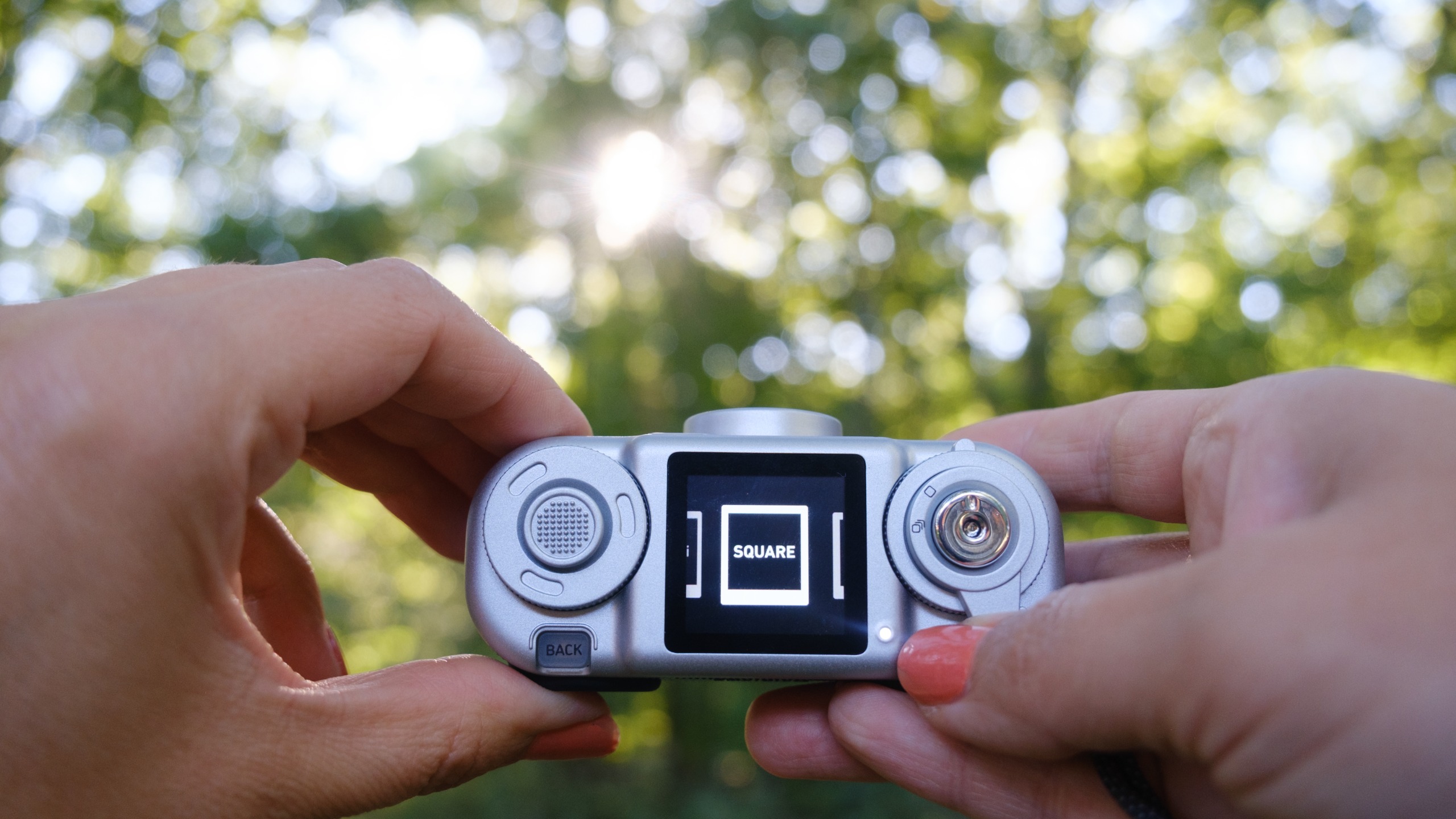The Instax Pal 2 in a photographer's hands