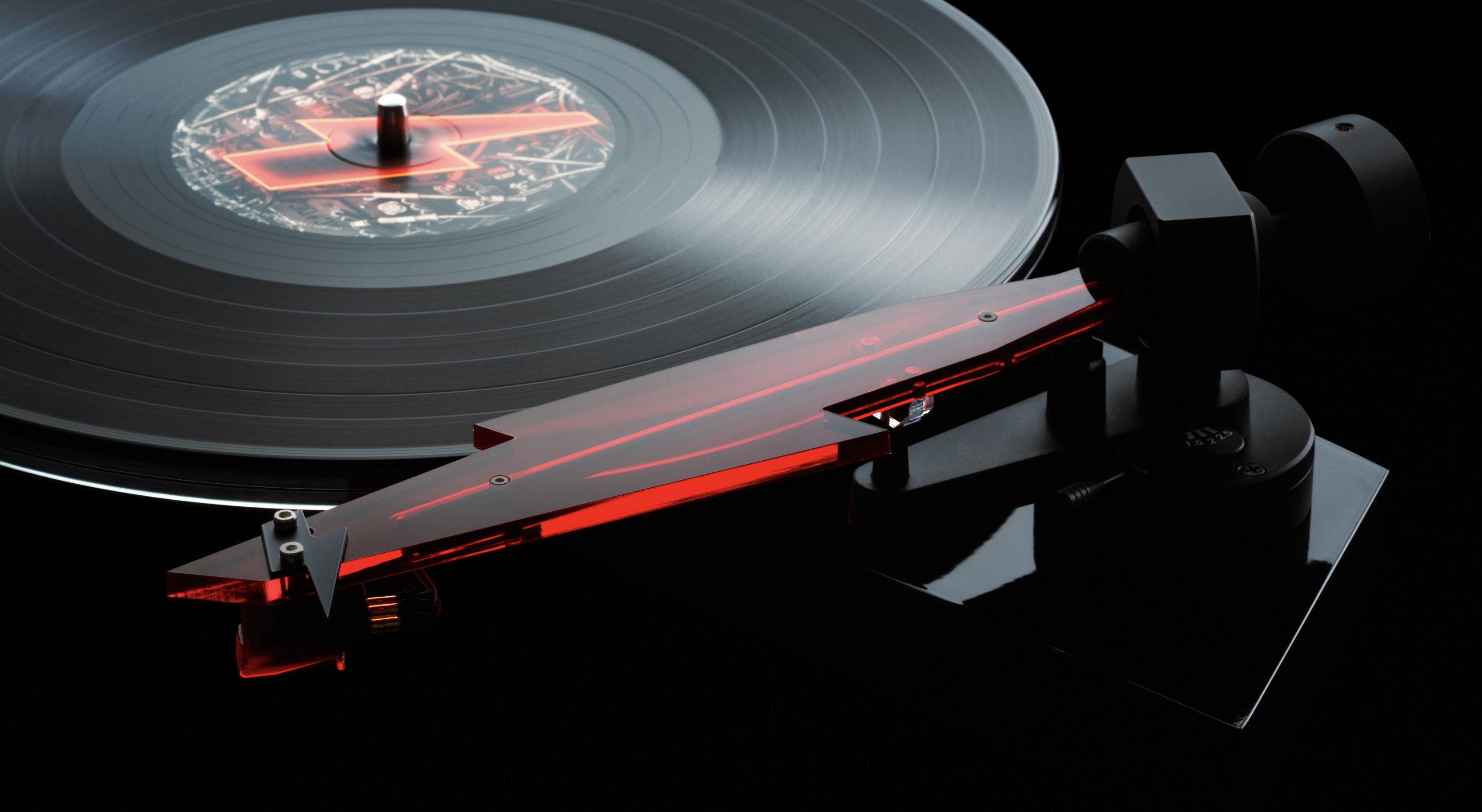 Pro-Ject's AC/DC turntable close-up of the red tonearm