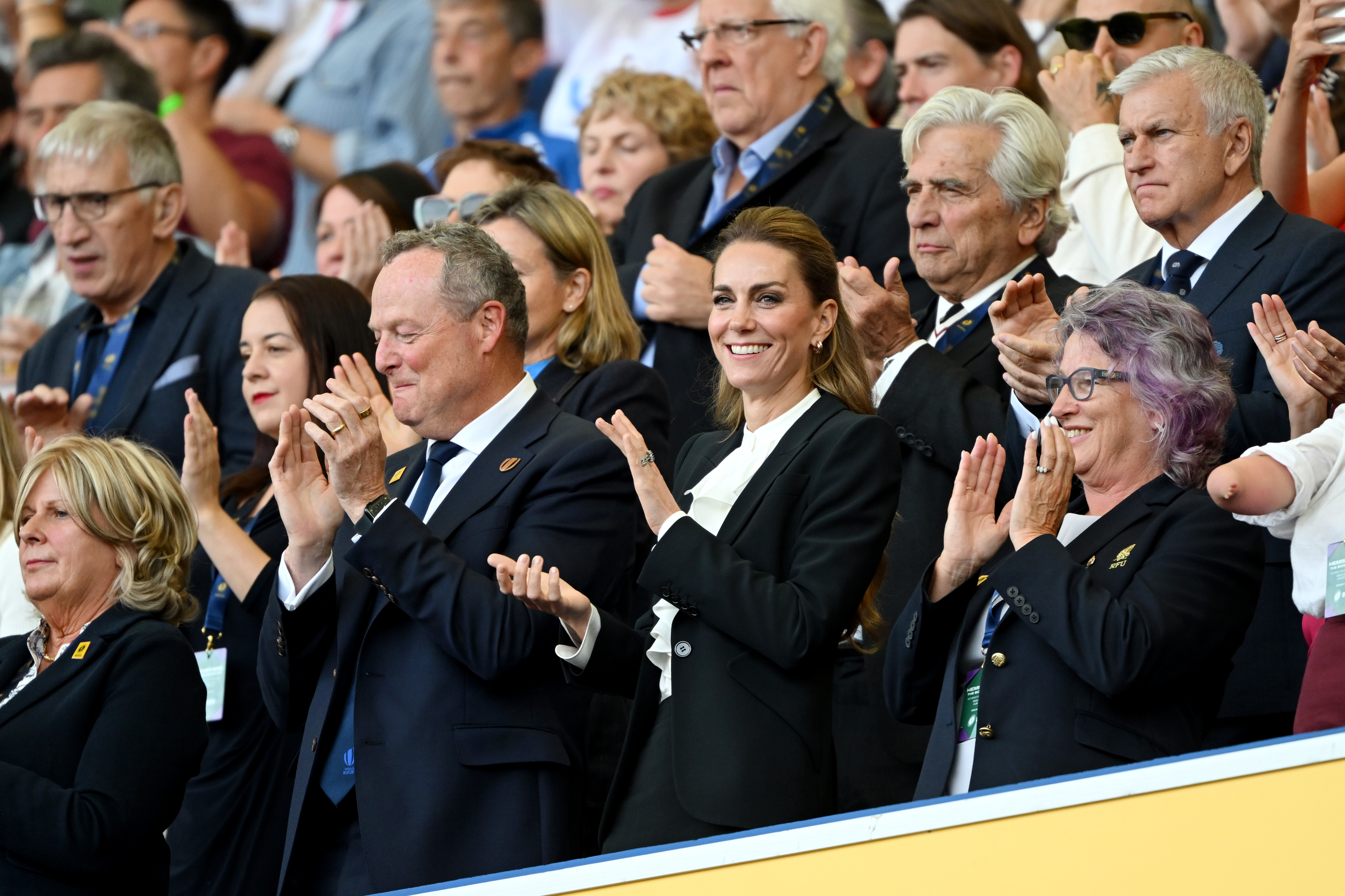 Kate Middleton attends the women&#039;s rugby wearing a black suit and ruffled white shirt