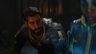 Saros launch trailer screenshot shows a concerned Arjun Devraj.