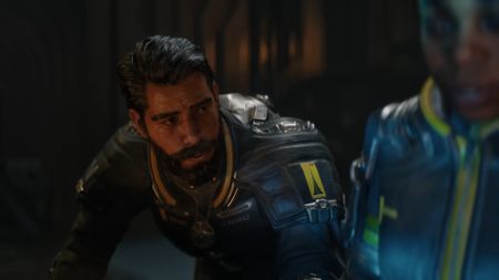 Saros launch trailer screenshot shows a concerned Arjun Devraj.